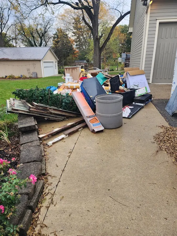 Dumpster being loaded with debris for Commercial Dumpster Rental in Brook Highland